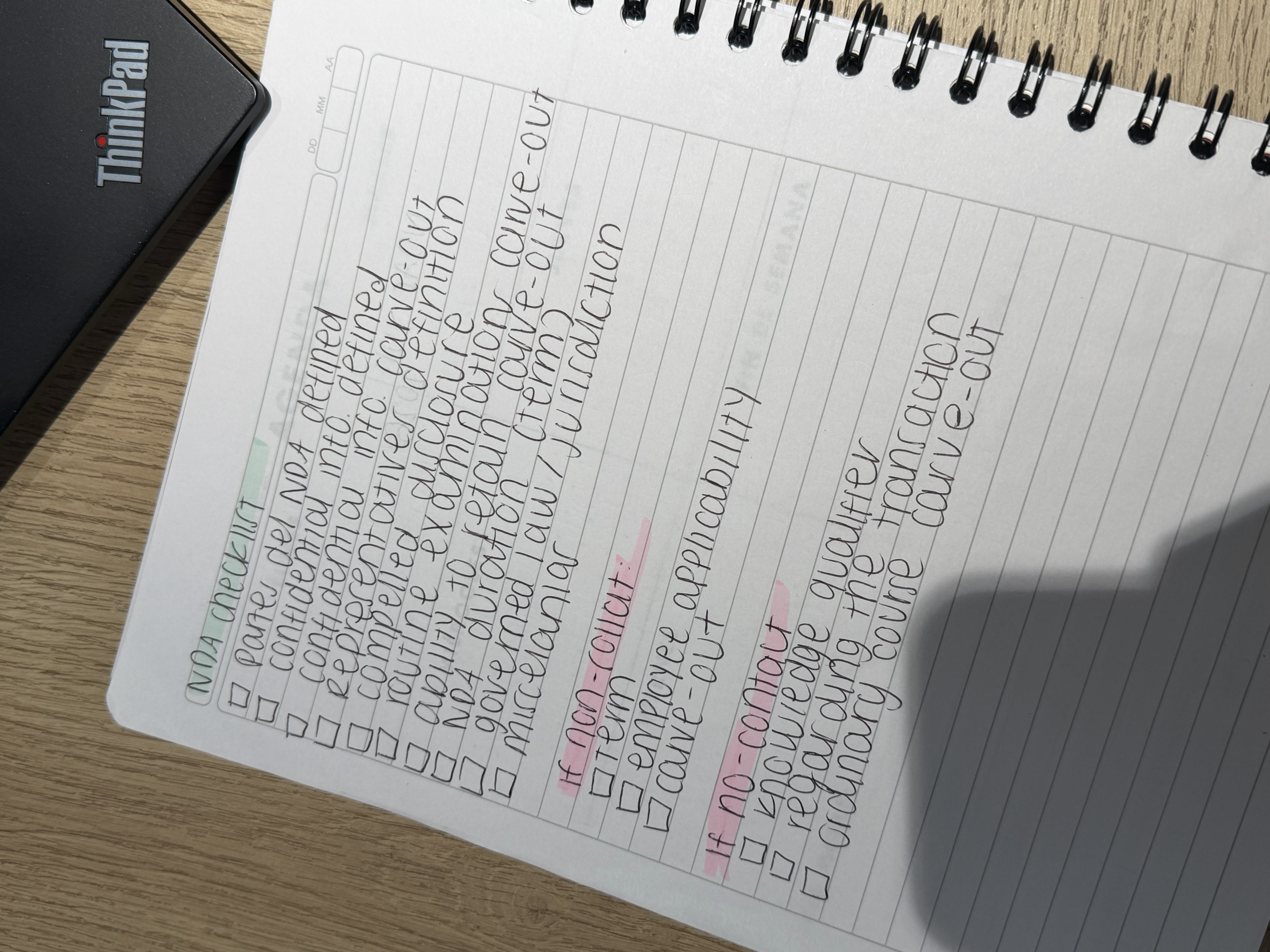 Another paper checklist showing handwritten task tracking by lawyers in Bogotá